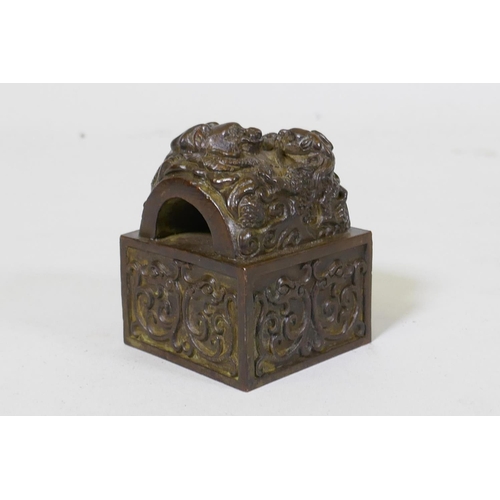 59 - Chinese bronze seal with raised dragon decoration, 6 x 6 x 7cm high