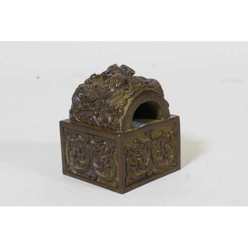 59 - Chinese bronze seal with raised dragon decoration, 6 x 6 x 7cm high