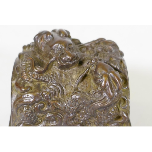 59 - Chinese bronze seal with raised dragon decoration, 6 x 6 x 7cm high