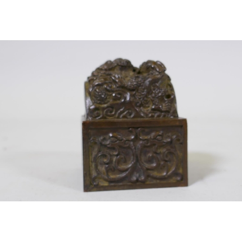 59 - Chinese bronze seal with raised dragon decoration, 6 x 6 x 7cm high