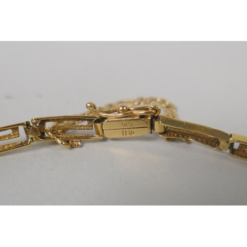 604 - A 14ct gold bracelet with a Greek key design, 8.7g