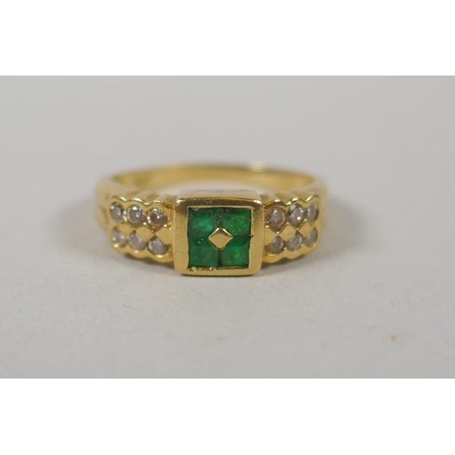 611 - An 18ct gold ring set with diamonds flanking emeralds, size M/N, 3.6g gross