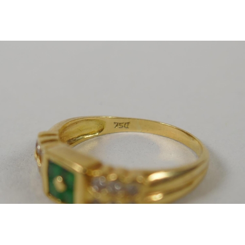 611 - An 18ct gold ring set with diamonds flanking emeralds, size M/N, 3.6g gross