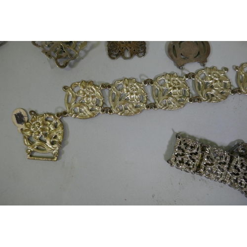 616 - A quantity of vintage costume jewellery including white metal belts and buckles