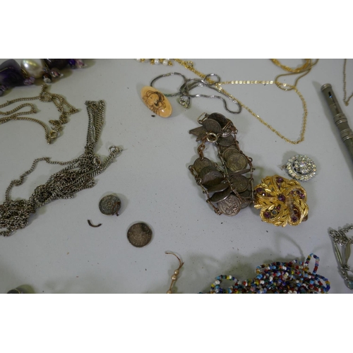 616 - A quantity of vintage costume jewellery including white metal belts and buckles