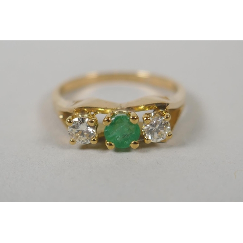 617 - A 14ct gold ring set with two diamonds flanking a green stone, size M, 3g gross