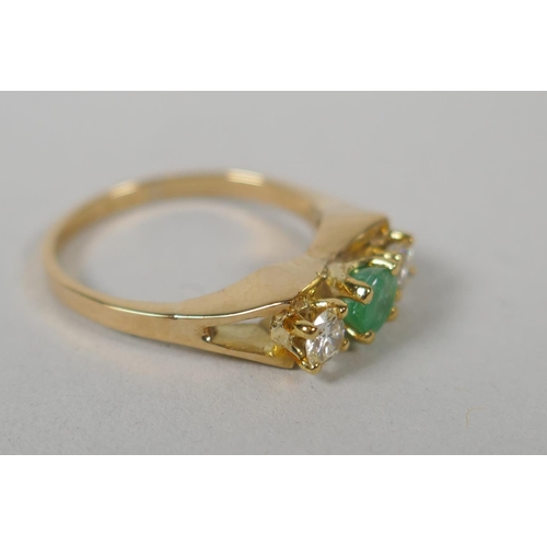 617 - A 14ct gold ring set with two diamonds flanking a green stone, size M, 3g gross