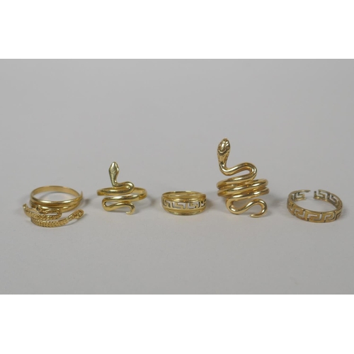 620 - Two 14ct gold snake rings and a 14ct gold Greek key design ring, and two other 14ct rings for scrap,... 