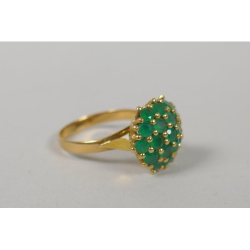 621 - A 14ct gold diamond and emerald dress ring, size M, and a gold and emerald cluster ring, marks rubbe... 