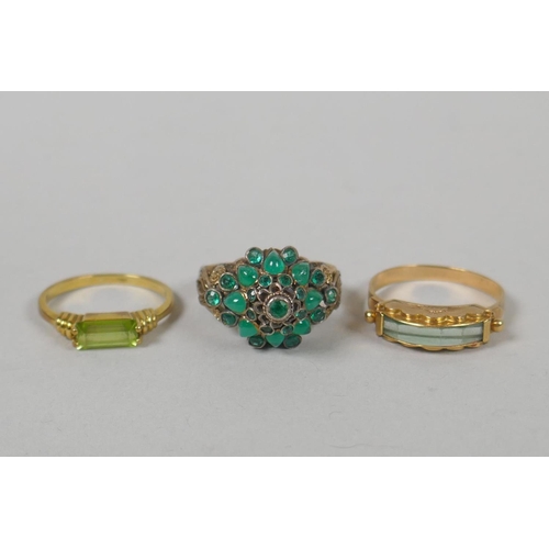 622 - A 14ct gold and peridot set ring, size L/M, a yellow metal and crystal set dress ring, marks rubbed,... 