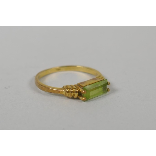 622 - A 14ct gold and peridot set ring, size L/M, a yellow metal and crystal set dress ring, marks rubbed,... 