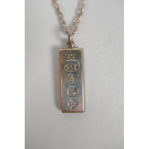 623 - Two hallmarked silver ingot pendant necklaces, and another hallmarked silver necklace, 67g total