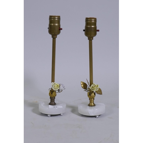 63 - A pair of brass table lamps with enamel rose decoration and glass bases, 29cm high