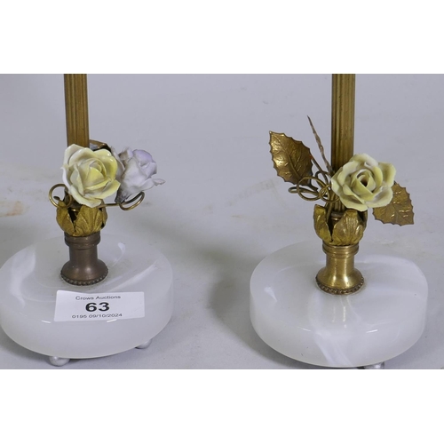 63 - A pair of brass table lamps with enamel rose decoration and glass bases, 29cm high