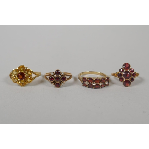 631 - Three 9ct gold dress rings set with garnets and citrines, sizes P, P and M, 7.3g gross, and a vintag... 