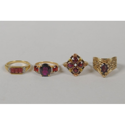 632 - Two vintage 10ct gold and garnet set dress rings, size Q and P, 5.4g gross, a 9ct gold and garnet th... 