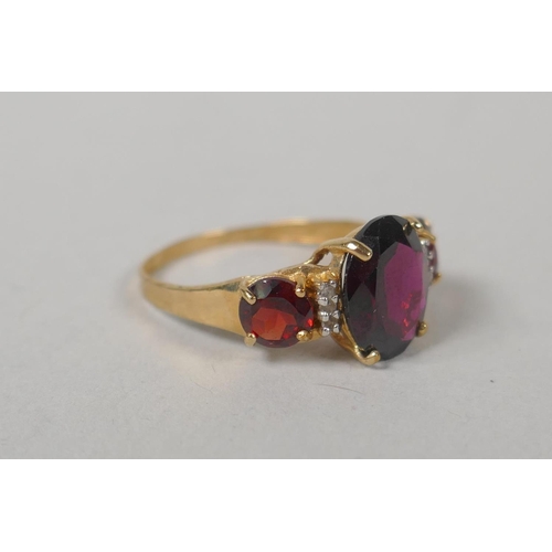 632 - Two vintage 10ct gold and garnet set dress rings, size Q and P, 5.4g gross, a 9ct gold and garnet th... 