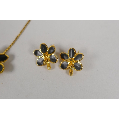 634 - A vintage set of Risis 24ct gold plated Orchid jewellery, to include two necklaces, a pair of earrin... 