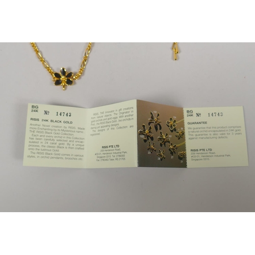 634 - A vintage set of Risis 24ct gold plated Orchid jewellery, to include two necklaces, a pair of earrin... 