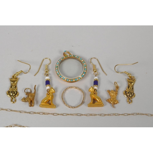 640 - A quantity of unmarked yellow metal jewellery to include lockets, pendants, necklaces, charms, earri... 