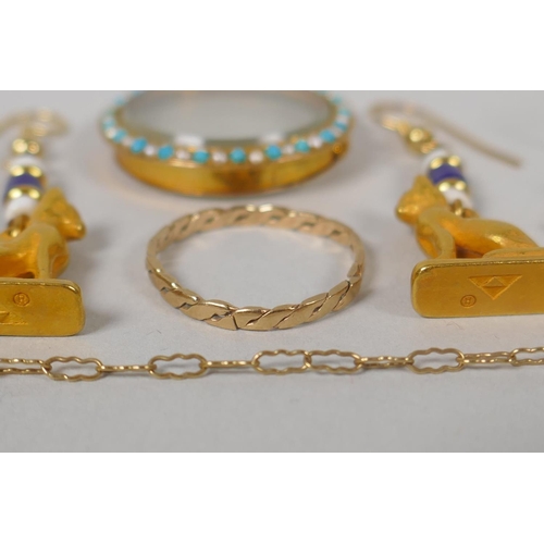 640 - A quantity of unmarked yellow metal jewellery to include lockets, pendants, necklaces, charms, earri... 