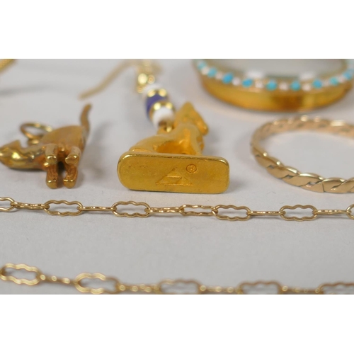 640 - A quantity of unmarked yellow metal jewellery to include lockets, pendants, necklaces, charms, earri... 