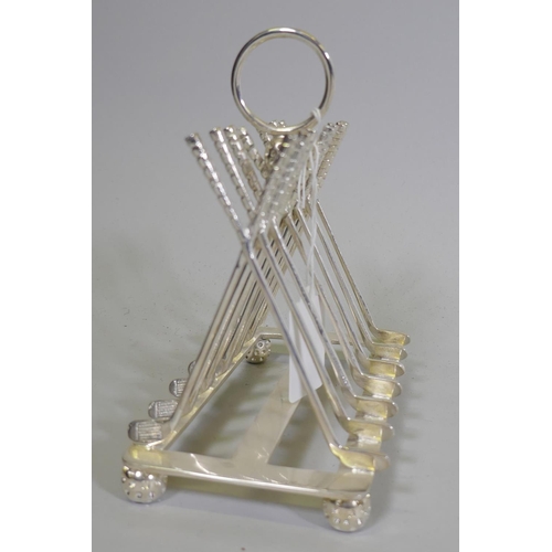 641 - A silver plated letter/toast rack in the form of leaning golf clubs, 16 x 9 x 16cm