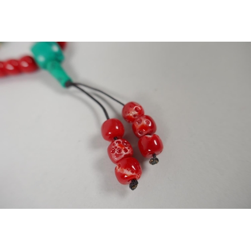 642 - A string of imitation coral mala beads, 82cm long