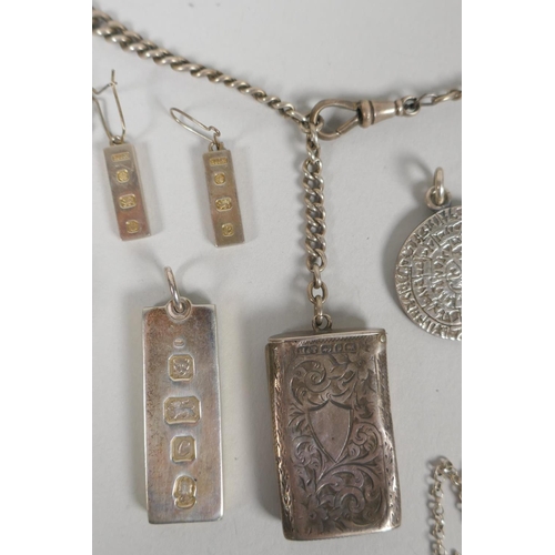 645 - A quantity of silver costume jewellery to include pendants, earrings, lockets, chains, charm bracele... 