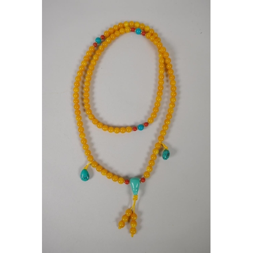 646 - A string of yellow hardstone style mala beads, with turquoise feature beads, 92cm