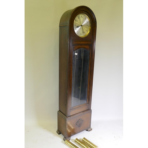 653 - A 1930s Art Deco style oak long case clock with dome top, silvered dial with Arabic numerals and eig... 