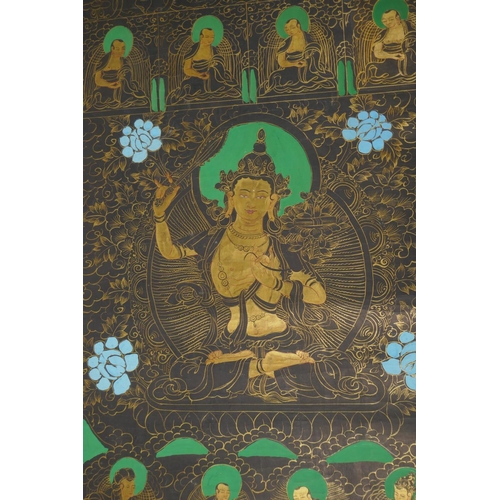 70 - A Tibetan hand painted thangka depicting Tara, 48 x 65cm