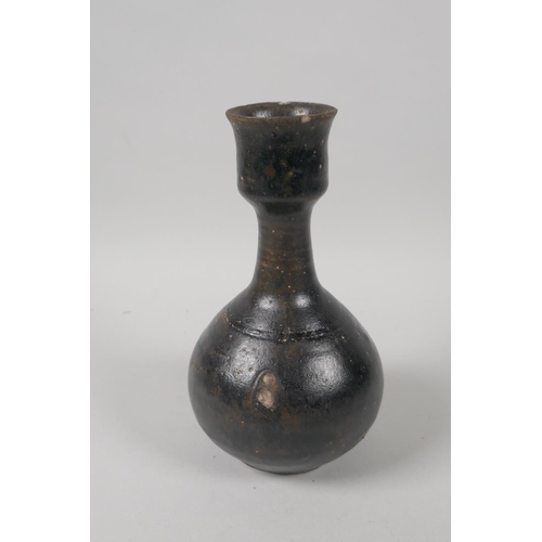 73 - A C19th Chinese treacle glazed pottery vase, 19cm high