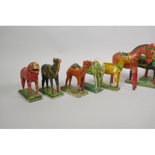 78 - A collection of Indian Nirmal carved and painted wooden figures of indigenous animals, some AF, larg... 