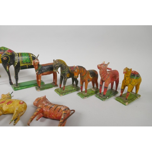 78 - A collection of Indian Nirmal carved and painted wooden figures of indigenous animals, some AF, larg... 