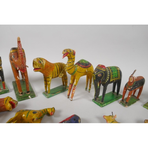 78 - A collection of Indian Nirmal carved and painted wooden figures of indigenous animals, some AF, larg... 