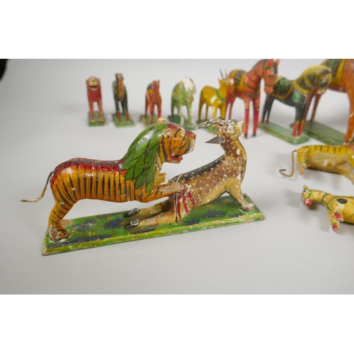 78 - A collection of Indian Nirmal carved and painted wooden figures of indigenous animals, some AF, larg... 