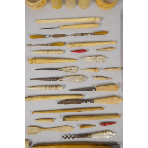 79 - A quantity of antique bone handled sewing items, button hooks, ink pens, etc