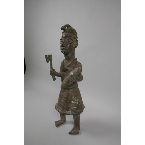 84 - An African Benin bronze figure of a warrior, 33cm high