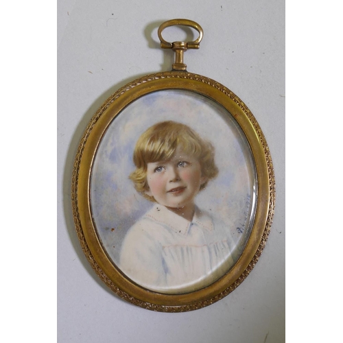 846 - Portrait miniature of a young child in a yellow metal frame, signed 'S' pinxit, 1918, 6 x 5cm