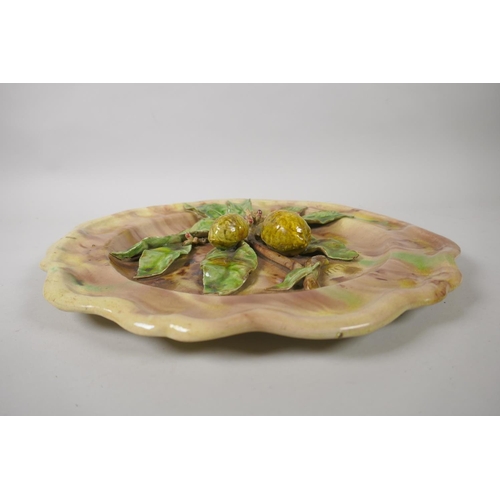 87 - A Palissy style majolica lemon platter, inscribed HNR, 34cm diameter