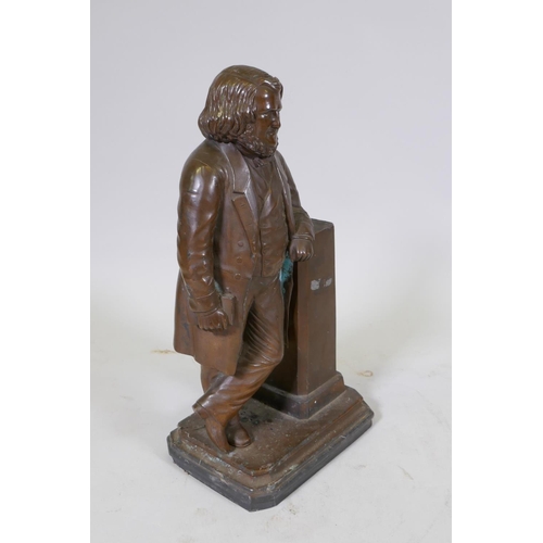 9 - William R. Brodie, (Scottish), bronze figure of a Victorian gentleman leaning against a plinth holdi... 