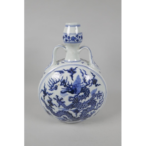 92 - A Chinese blue and white porcelain two handled moon flask with dragon decoration, Xuande 6 character... 