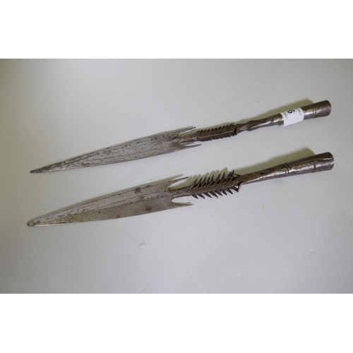 93 - Two African, Nigerian/Yoruba barbed metal spear heads, 30cm long