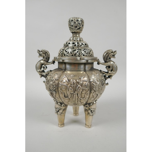 97 - A Chinese white metal censer and cover with kylin handles and tripod supports, 23cm high