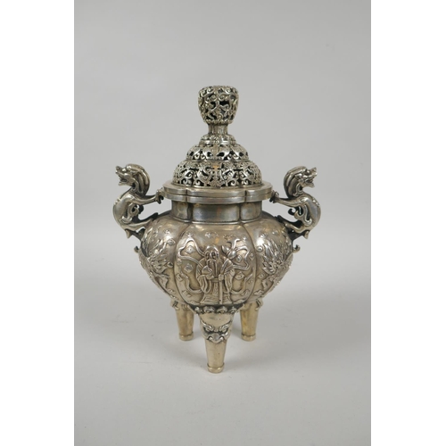 97 - A Chinese white metal censer and cover with kylin handles and tripod supports, 23cm high