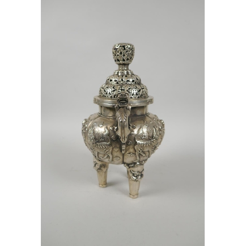 97 - A Chinese white metal censer and cover with kylin handles and tripod supports, 23cm high