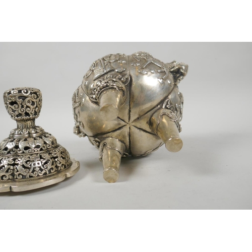 97 - A Chinese white metal censer and cover with kylin handles and tripod supports, 23cm high