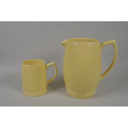 98 - Keith Murray for Wedgwood, yellow glazed matching jug and mug, 21cm high