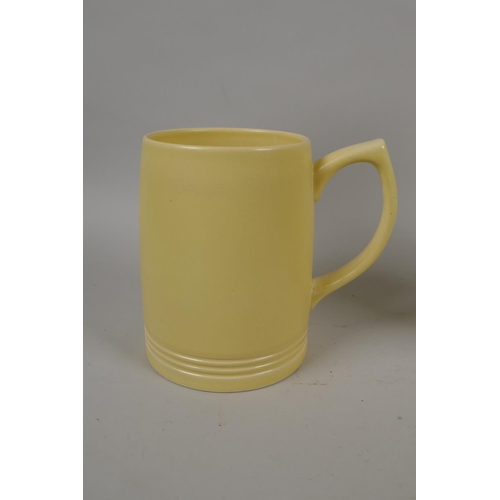 98 - Keith Murray for Wedgwood, yellow glazed matching jug and mug, 21cm high